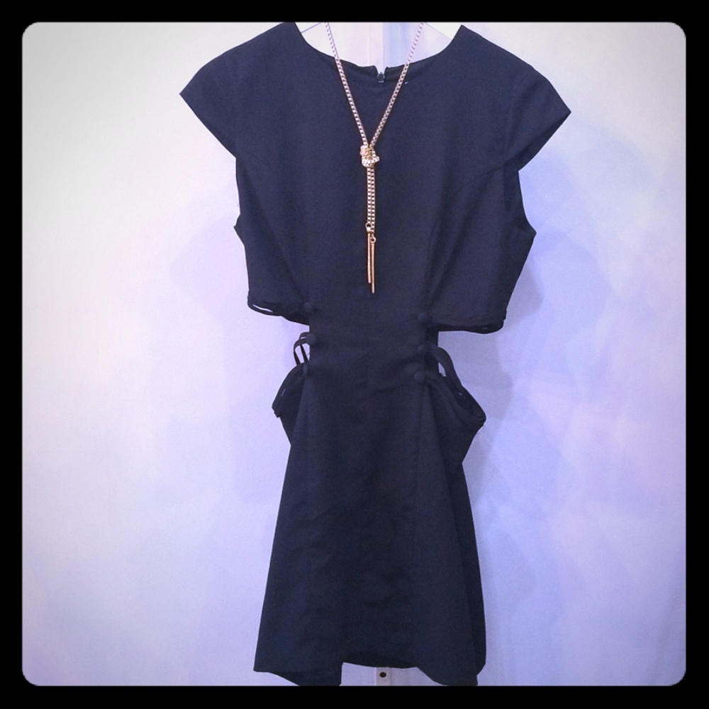 Fitted black dress with side cutouts